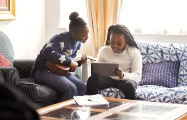 two women looking at iPad