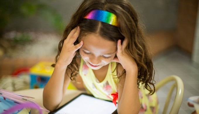 Child looking at tablet